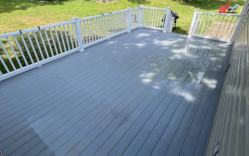 deck with white fencing after cleaning